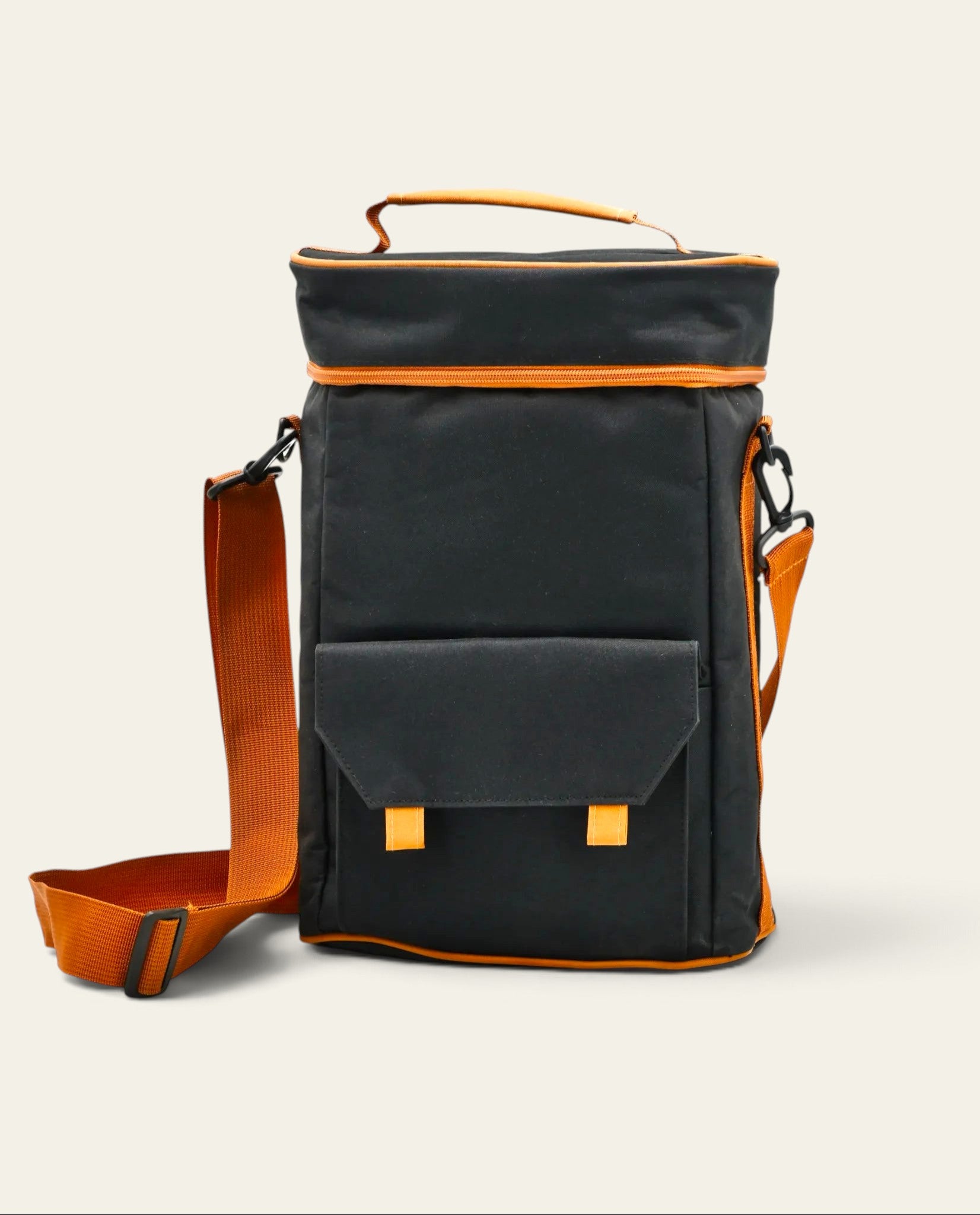 Boldo black mate bag with tan trim, featuring an adjustable shoulder strap, front pocket, and waterproof interior.