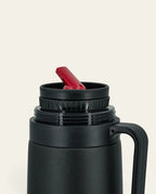 Boldo stainless steel thermos with a black finish, featuring a red precision pouring spout and ergonomic handle.